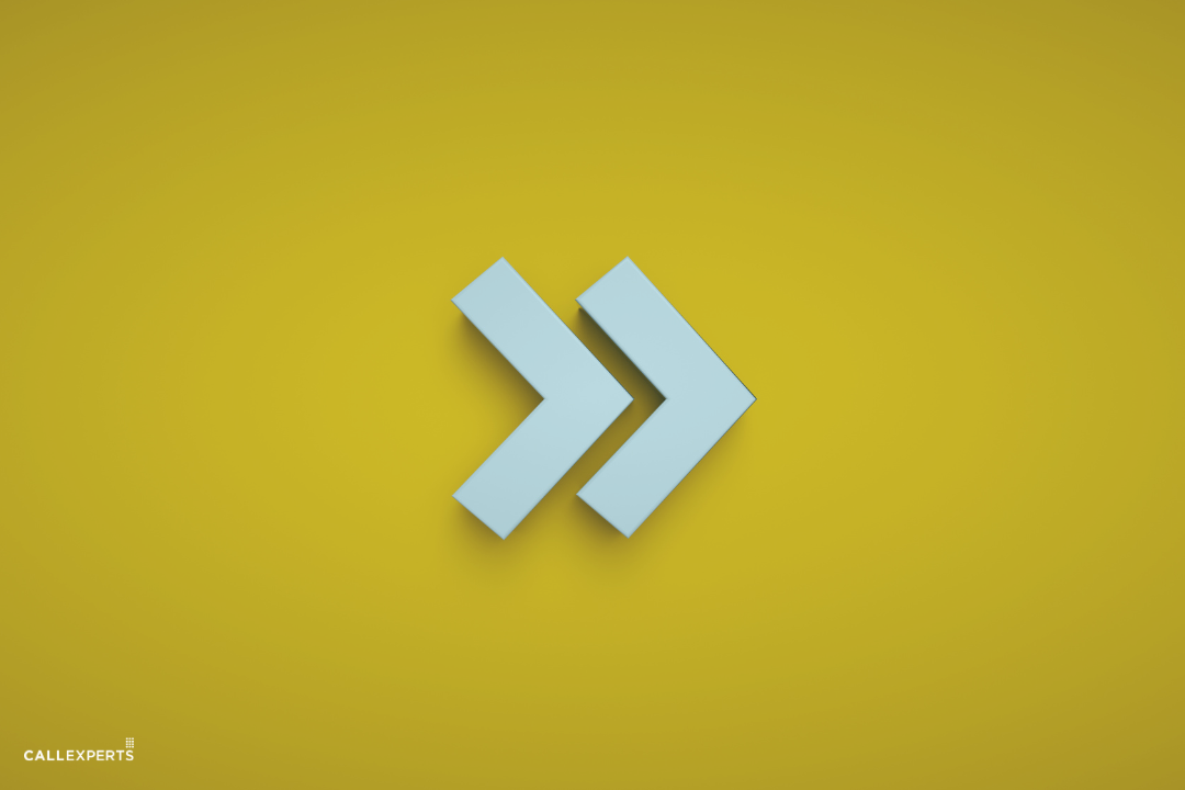 A pair of blue forward arrow icons centered on a yellow background.